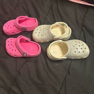 two pair of cros. pink toddler crocs & white glitter crocs